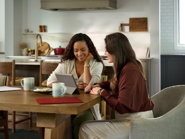 photograph of a redfin agent with a customer