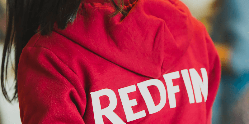 picture of Redfin employee wearing a Redfin hoodie