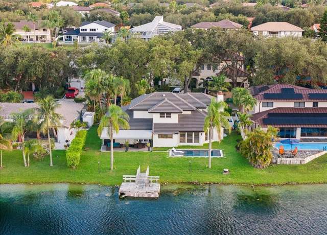 Property at 8001 NW 166th St, Miami Lakes, FL 33016, 4 beds, 3 baths