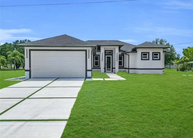Property at 418 8th Ave, Lehigh Acres, FL 33972, 3 beds, 2 baths
