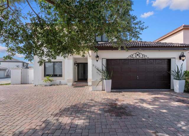 Property at 8279 NW 199th St, Hialeah, FL 33015, 4 beds, 2.5 baths