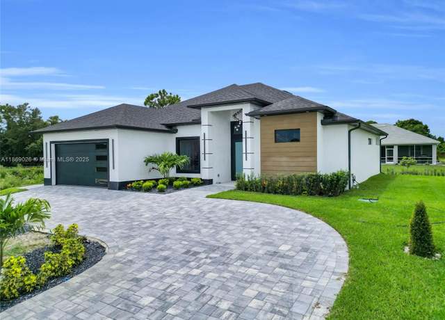 Property at 911 Sara Ave N, Lehigh Acres, FL 33971, 4 beds, 2.5 baths