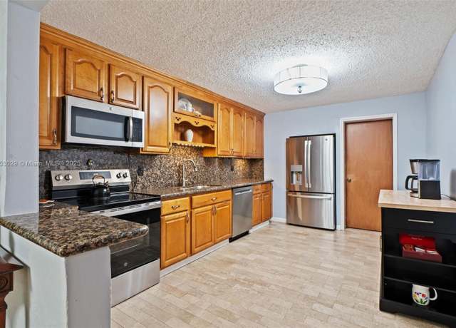 Property at 5614 Hope St, Hollywood, FL 33021, 3 beds, 2 baths