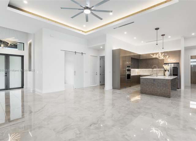 Property at 5 SW 37th Ave, FL 33991, 3 beds, 3.5 baths