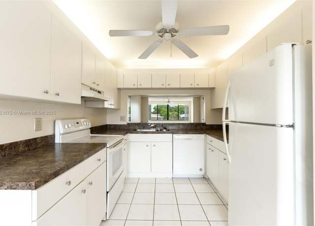 Property at 9455 N Belfort Cir #211, Tamarac, FL 33321, 2 beds, 2 baths