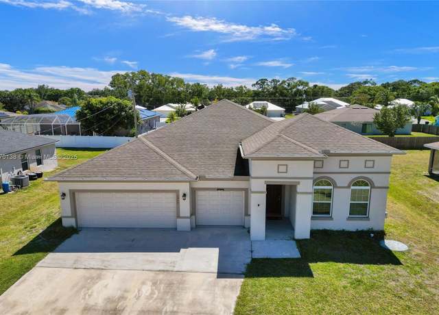 Property at 1957 SW Logan St, Port St. Lucie, FL 34953, 5 beds, 3 baths