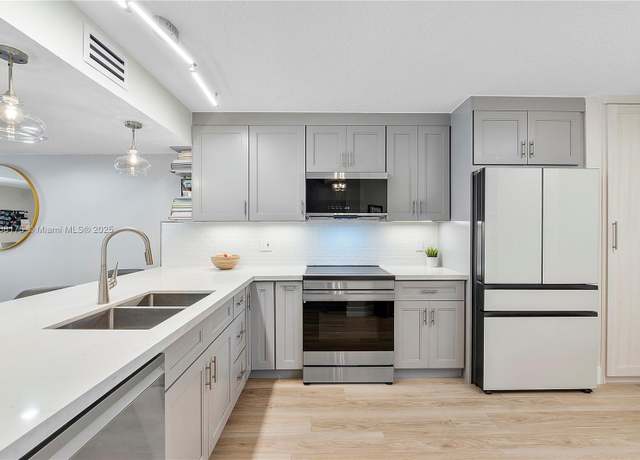 Property at 1357 NW 123rd Ter Unit -, Pembroke Pines, FL 33026, 2 beds, 2.5 baths