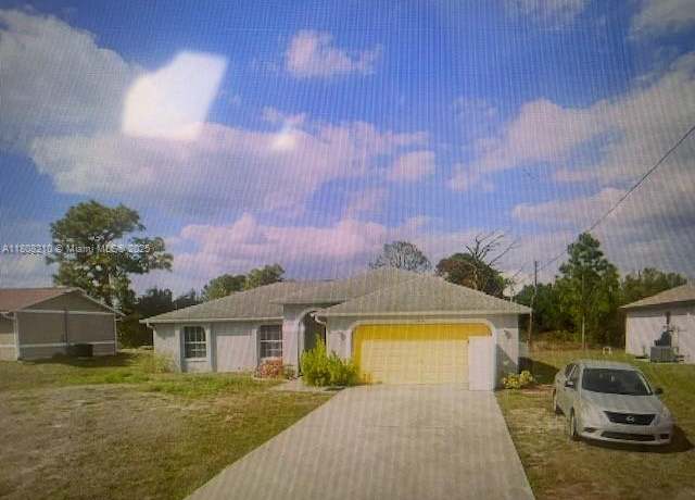 Property at 2714 15 SW, Lehigh Acres, FL 33976, 3 beds, 2 baths