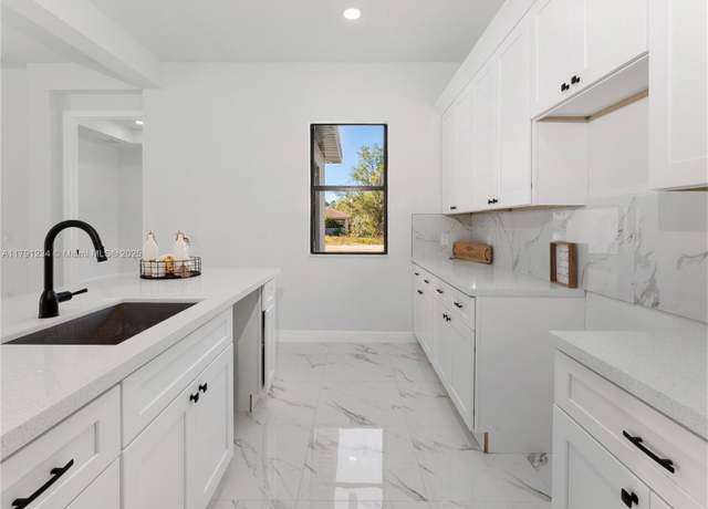 Property at 923 Winters St E, Lehigh Acres, FL 33974, 4 beds, 2 baths