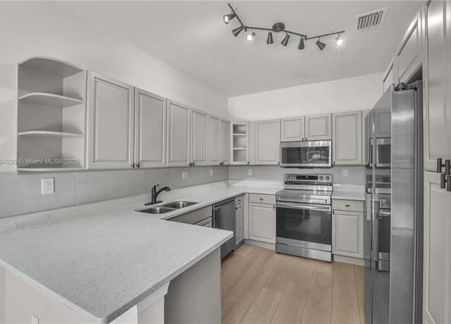Property at 1125 Doveplum St, Hollywood, FL 33019, 3 beds, 2.5 baths