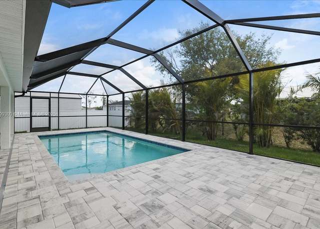 Property at 2423 NW 20th Pl, Cape Coral, FL 33993, 4 beds, 3 baths