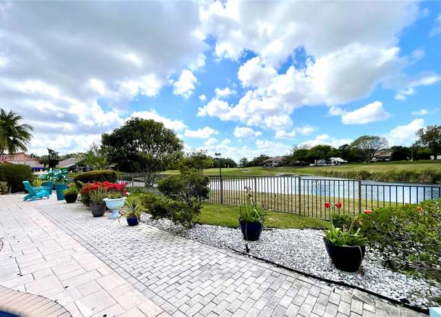 Property at 12022 Classic Dr, Coral Springs, FL 33071, 5 beds, 3 baths