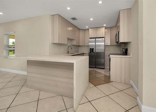 Property at 411 NE 58th Ct, Oakland Park, FL 33334, 3 beds, 3.5 baths