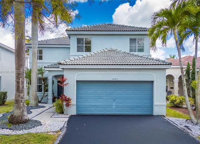 Property at 1042 Bluewood Ter, Weston, FL 33327, 5 beds, 3.5 baths