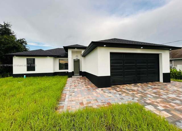 Property at 310 Rainier Ave, Lehigh Acres, FL 33974, 3 beds, 3 baths
