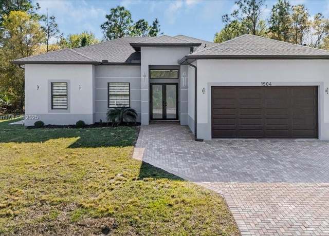 Property at 1504 E 6th St, Lehigh Acres, FL 33972, 3 beds, 2.5 baths