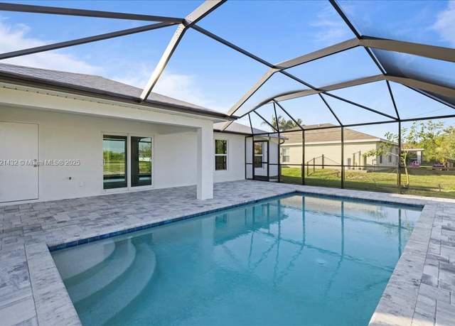 Property at 1127 NW 6th Pl, Cape Coral, FL 33993, 4 beds, 3 baths
