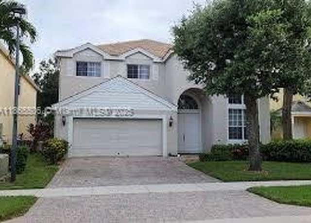 Property at 305 Berenger Walk, Royal Palm Beach, FL 33414, 4 beds, 3 baths