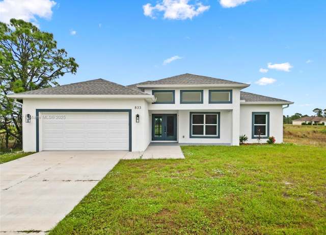 Property at 833 Newell St E, Lehigh Acres, FL 33974, 3 beds, 2 baths