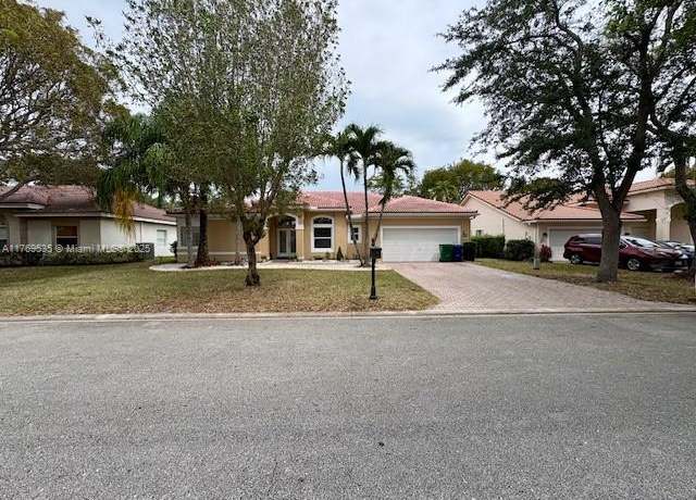 Property at 10261 NW 54th Pl, Coral Springs, FL 33076, 4 beds, 3 baths