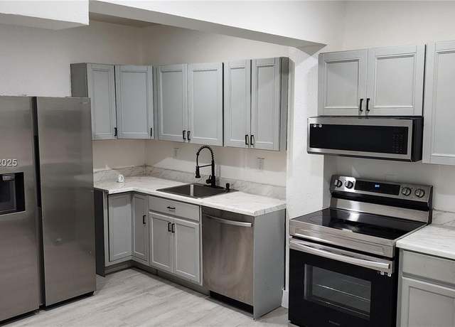 Property at 1821 NW 185th St, Miami Gardens, FL 33056, 5 beds, 2.5 baths