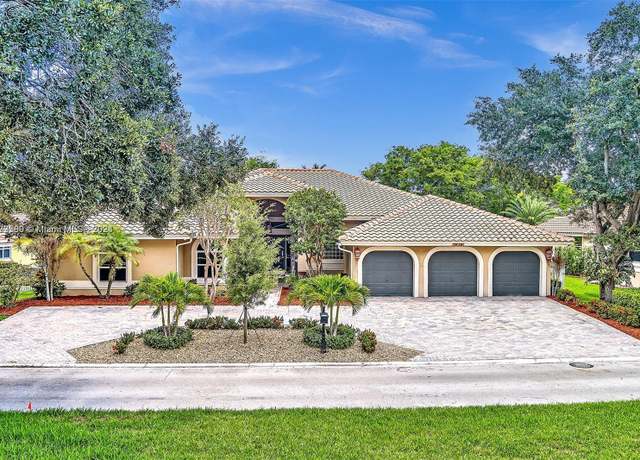 Property at 1775 W Eagle Trace Blvd W, Coral Springs, FL 33071, 4 beds, 4.5 baths