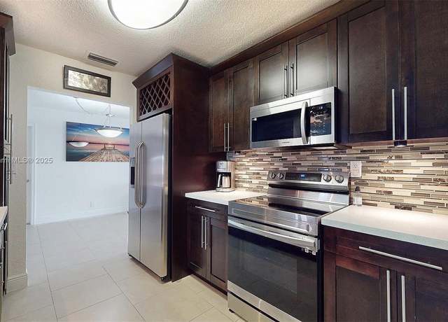 Property at 7504 NW 70th Ave, Tamarac, FL 33321, 3 beds, 2 baths