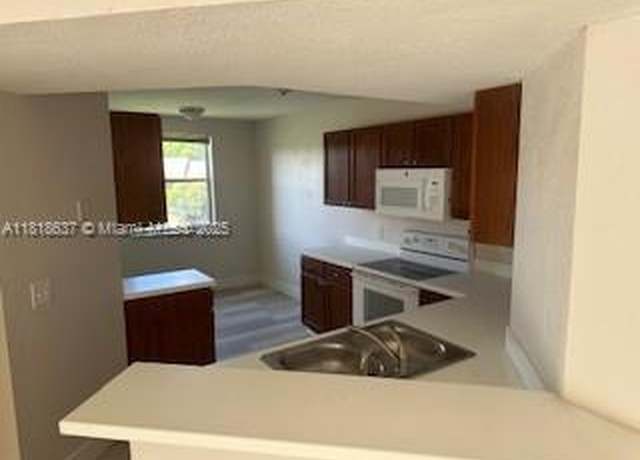 Property at 8741 Wiles Rd #208, Coral Springs, FL 33067, 3 beds, 2 baths