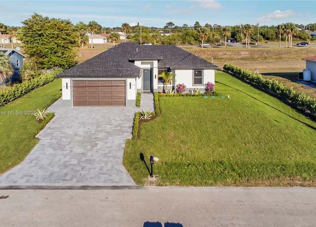 Property at 912 Rita Ave N, Lehigh Acres, FL 33971, 3 beds, 2 baths