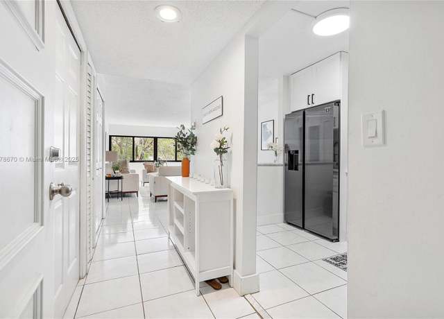 Property at 301 Racquet Club Rd #208, Weston, FL 33326, 1 bed, 1.5 baths