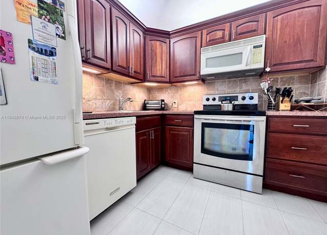 Property at 20500 W Country Club Dr #210, Aventura, FL 33180, 1 bed, 1.5 baths