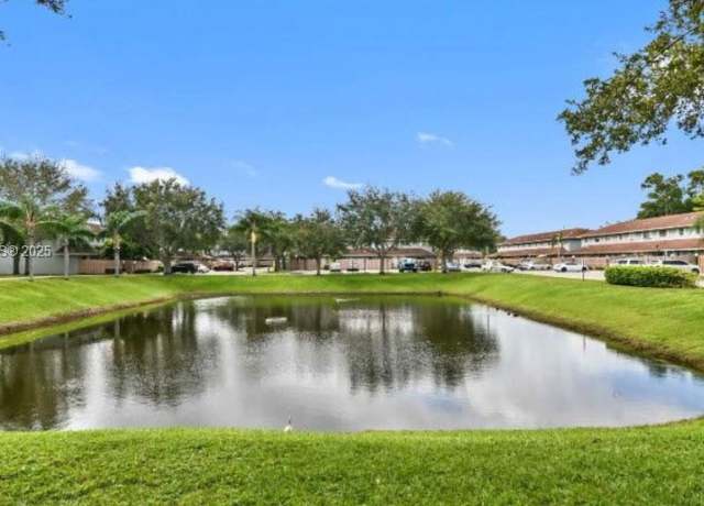 Property at 910 E Cypress Way E, Palm Springs, FL 33406, 3 beds, 2.5 baths
