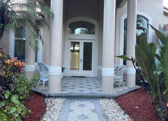 Property at 7037 NW 62nd Ter, Parkland, FL 33067, 4 beds, 3 baths