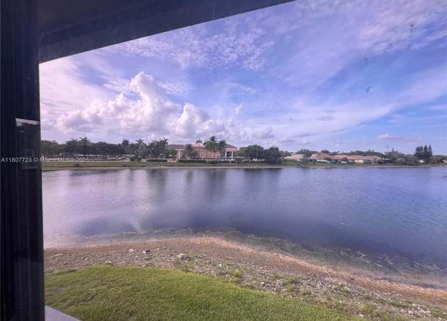 Property at 9873 N Belfort Cir #215, Tamarac, FL 33321, 2 beds, 2 baths