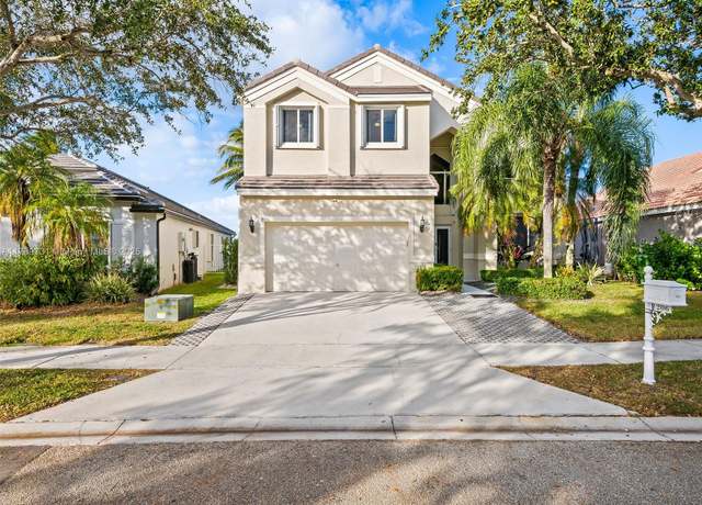 Property at 1206 Falls Blvd, Weston, FL 33327, 5 beds, 3.5 baths