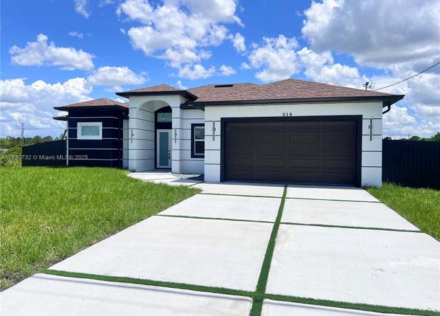 Property at 814 Jaguar Blvd, Lehigh Acres, FL 33974, 4 beds, 2 baths