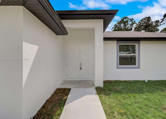 Property at 2613 73rd St W, Lehigh Acres, FL 33971, 3 beds, 2 baths