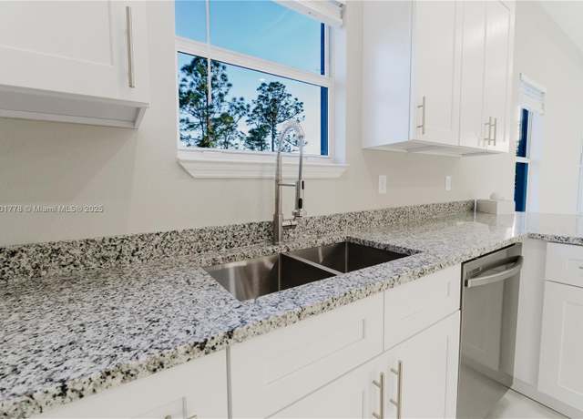 Property at 970 Grant Blvd, Lehigh Acres, FL 33974, 4 beds, 2 baths