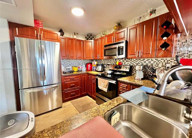 Property at 6305 Gage Pl Unit A-307, Miami Lakes, FL 33014, 1 bed, 1.5 baths