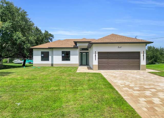 Property at 814 Mckinley Ave, Lehigh Acres, FL 33972, 3 beds, 2 baths