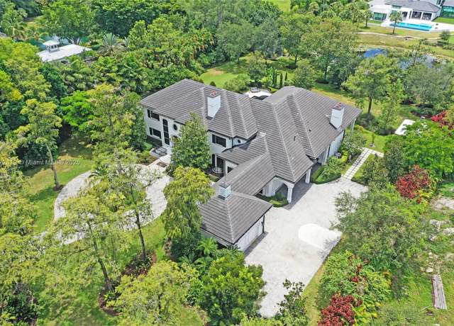 Property at 9004 NW 70th Ct, Parkland, FL 33067, 7 beds, 5.5 baths