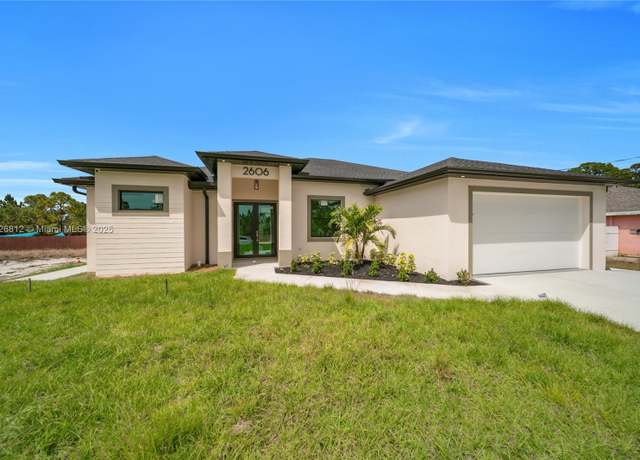 Property at 2606 34th St SW, Lehigh Acres, FL 33976, 4 beds, 3 baths