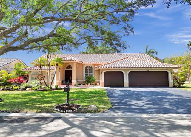 Property at 10456 NW 48th Mnr, Coral Springs, FL 33076, 4 beds, 3 baths