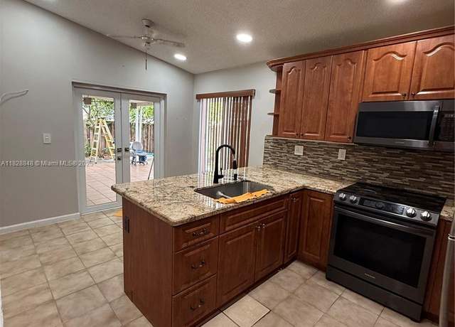 Property at 19926 NW 67th Pl, Hialeah, FL 33015, 4 beds, 2 baths