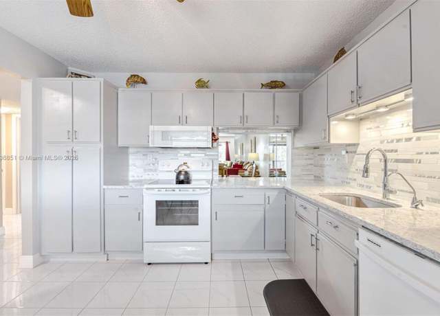 Property at 4955 E Sabal Palm Blvd #305, Tamarac, FL 33319, 2 beds, 2 baths