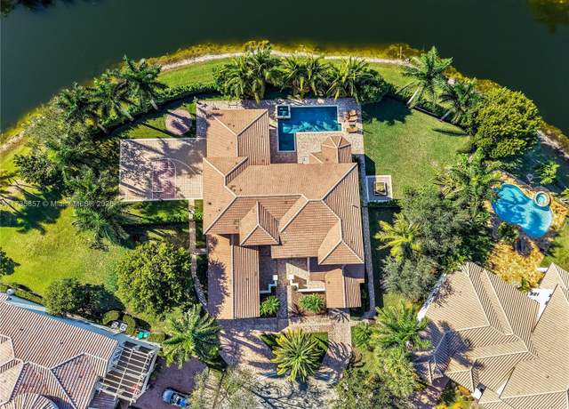 Property at 12008 NW 69th Ct, Parkland, FL 33076, 6 beds, 5.5 baths