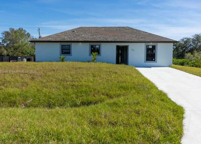 Property at 1302 Hibiscus Ave, Lehigh Acres, FL 33972, 3 beds, 2 baths