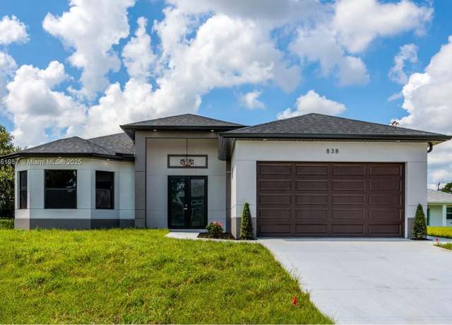 Property at 838 Chantilly St E, Lehigh Acres, FL 33974, 4 beds, 2 baths