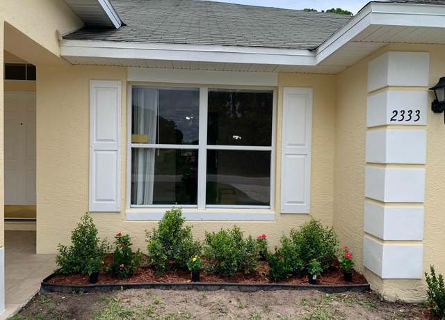 Property at 2333 Jupiter Blvd SW, Palm Bay, FL 32908, 4 beds, 3 baths