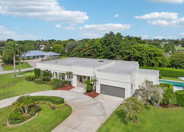 Property at 257 N Country Club Dr, Atlantis, FL 33462, 4 beds, 4.5 baths